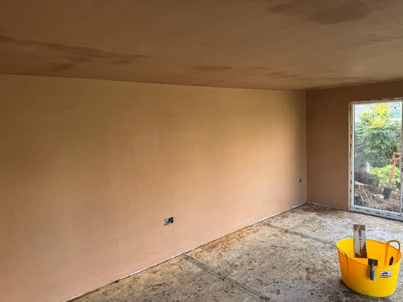Room plastering with ceiling and wall skim in an extension