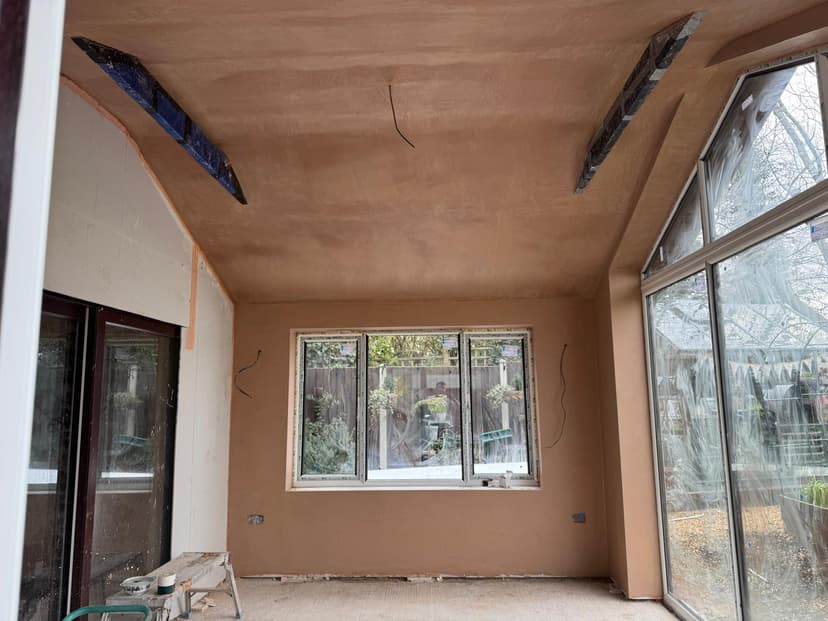 Loft conversion with freshly plastered walls and ceiling