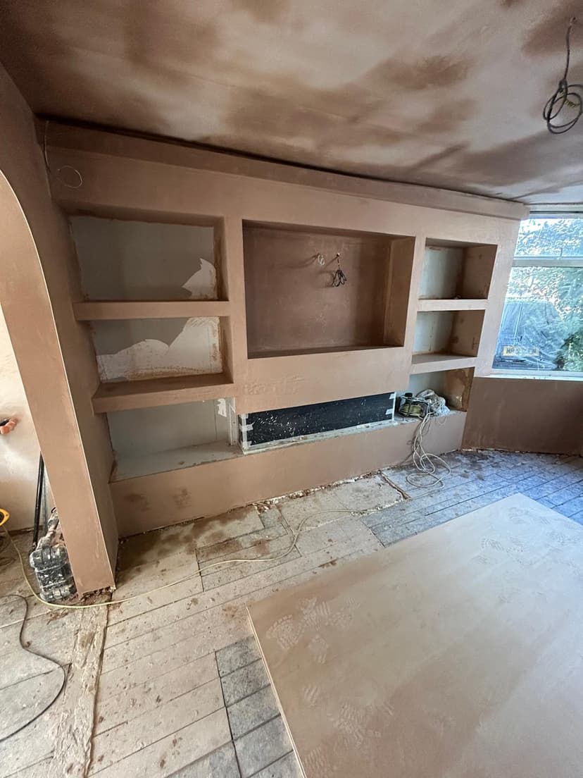 Commercial bathroom with plastered ceiling and vanity partitions