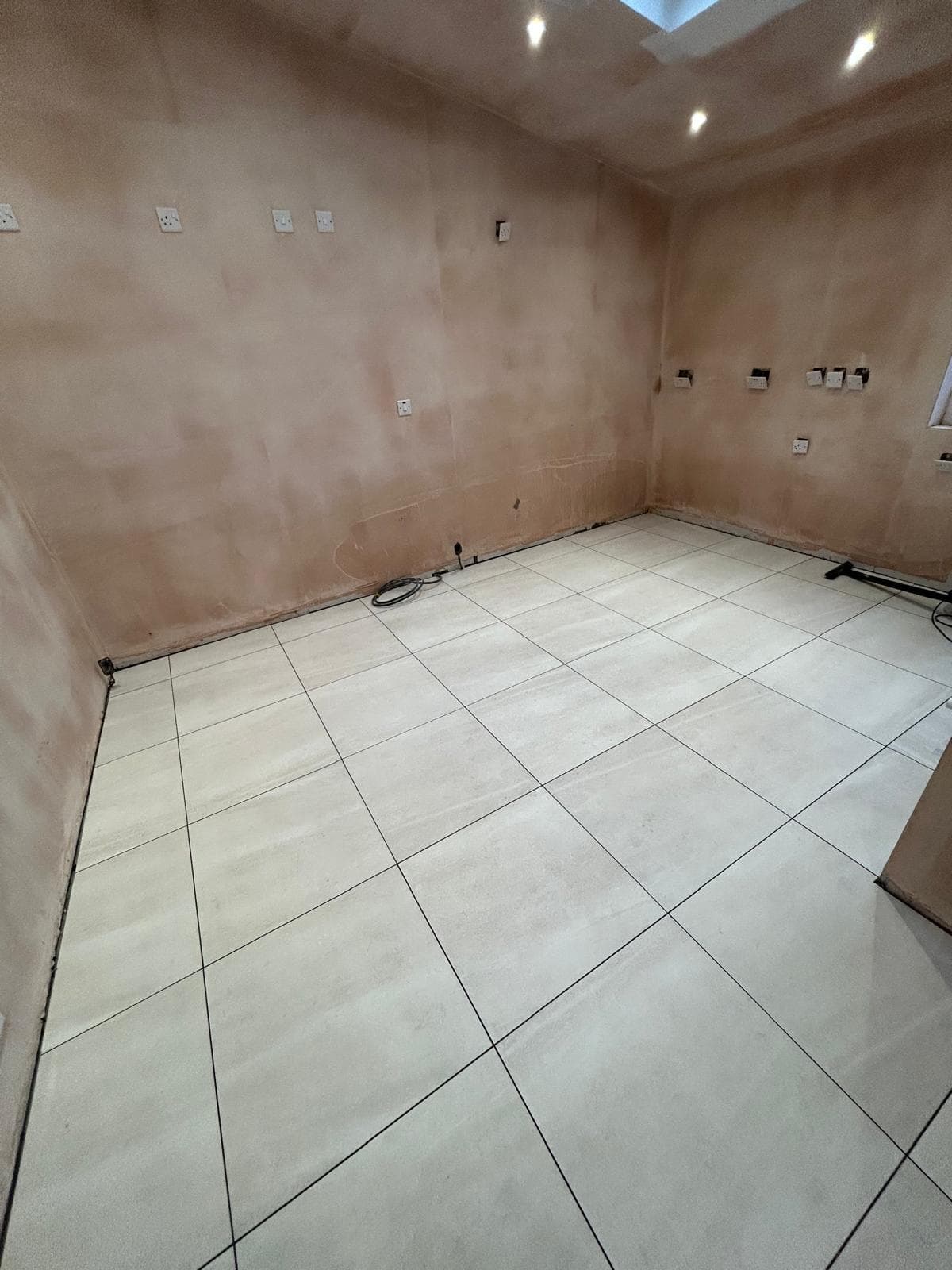 Smooth skim finish on kitchen extension walls with skylight