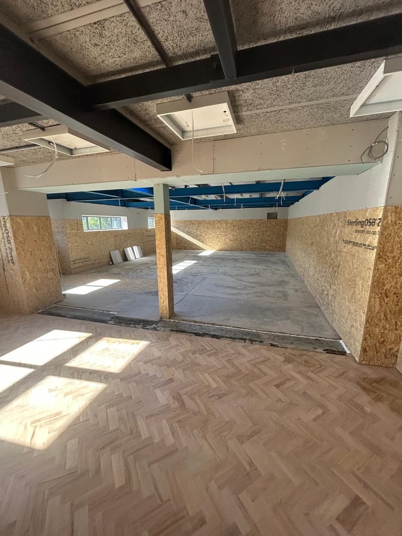 Media wall shelving unit with smooth plaster surround