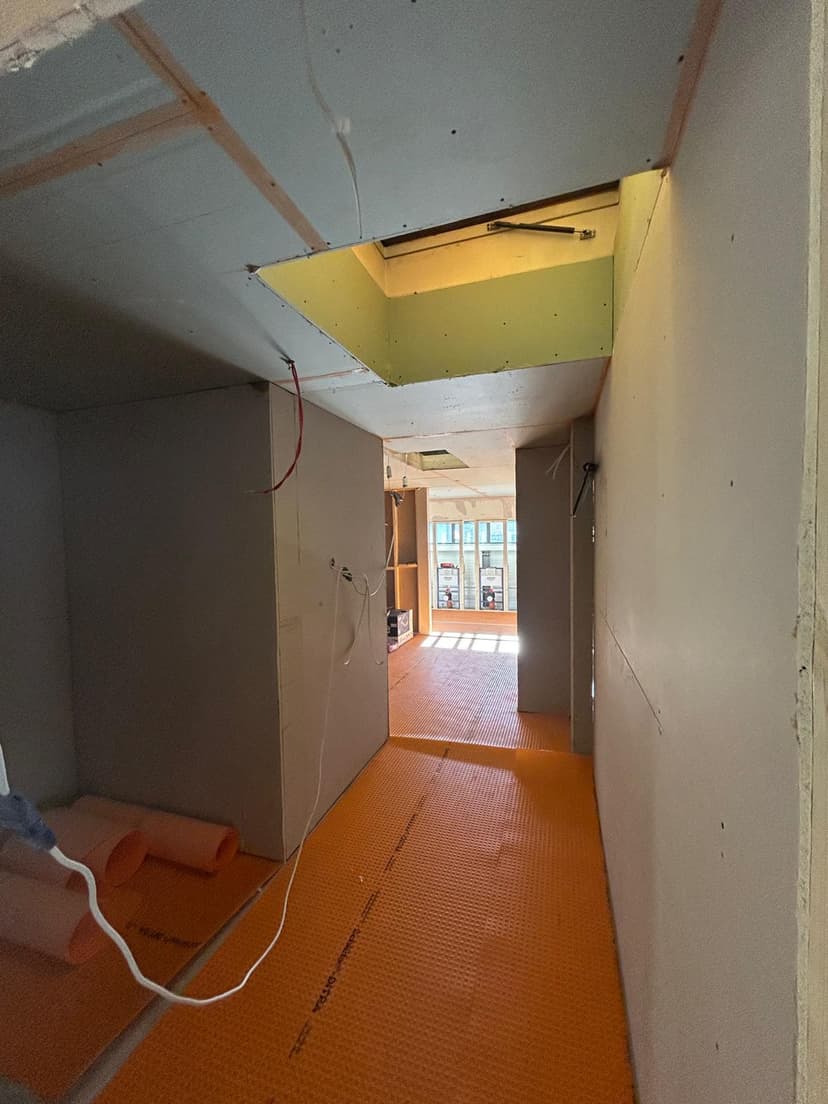 Freshly plastered partition walls with doorway openings