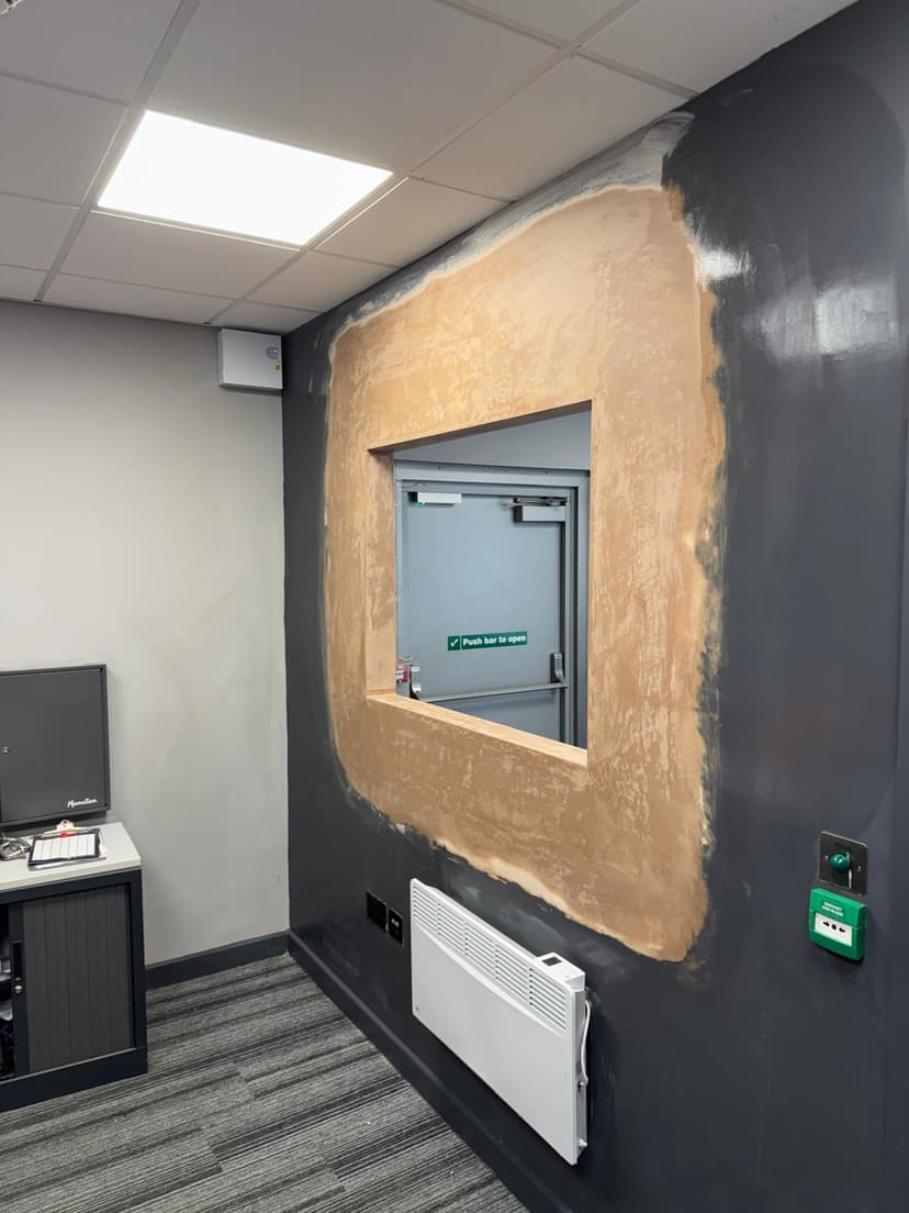 Smooth skim finish on kitchen extension walls with skylight