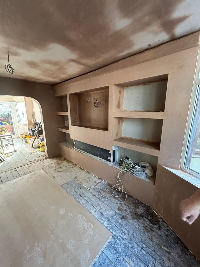 Freshly plastered extension room with smooth walls and ceiling